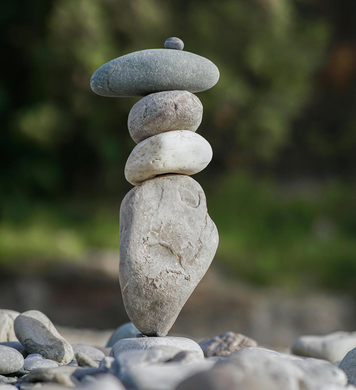 Photo by ABHIJEET SINGH close up of a rock cairn