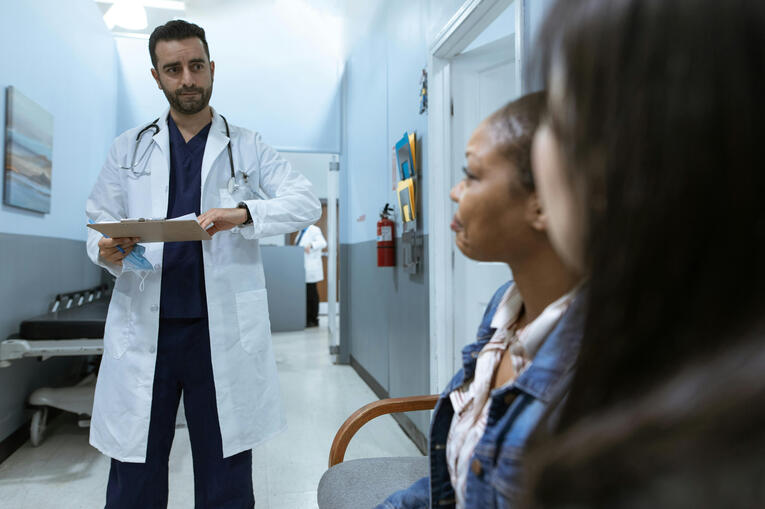 Photo by RDNE Stock project Doctor in white medical scrub suit providing technical, healthcare, and mental health therapy for a girl who is overwhelmed with her work life balance.